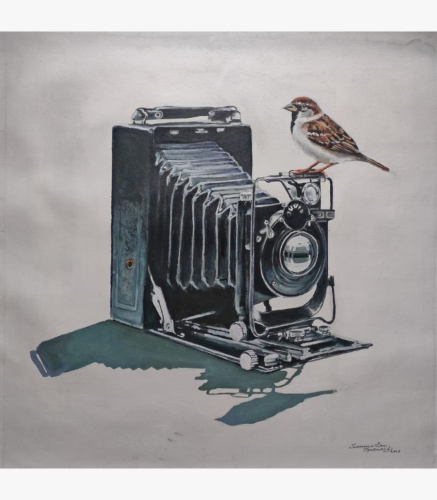 focus-vintage-camera-acrylic-on-canvas A realistic acrylic painting by Mr. Shrinivasa titled Focus, featuring a detailed vintage bellows camera with a small sparrow perched on top, set against a neutral 18x18 inch canvas. 3. Product Title