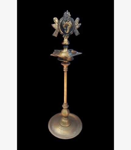 A high-end handcrafted brass ritual pooja bell featuring an intricate feather-shaped handle and a genuine Rudraksha bead in a red velvet gift box.