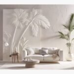 A large 48x72-inch hand-carved white plaster wall relief titled Coastal Palms Relief featuring elegant palm tree silhouettes above a modern white sofa.