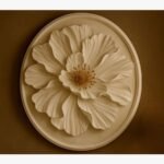 A 36-inch diameter circular hand-cast plaster wall sculpture titled Celestial Bloom Medallion featuring a high-relief flower design in an elegant off-white finish.
