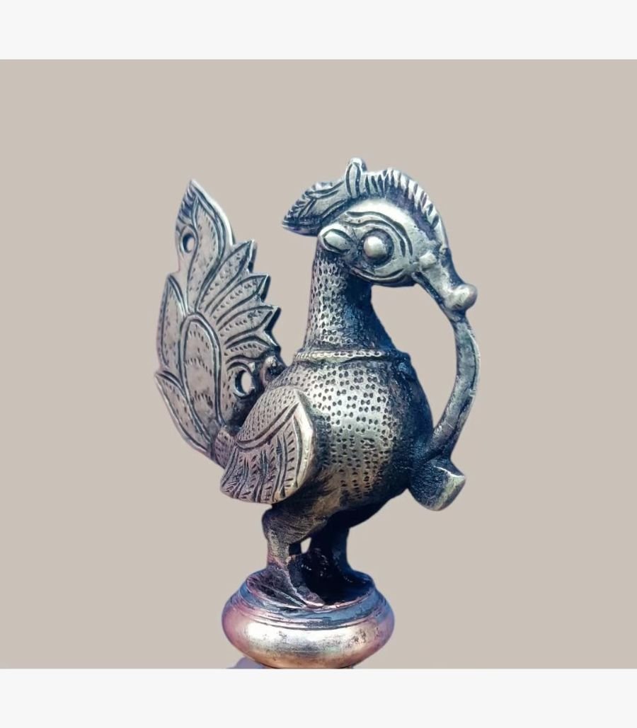 Imperial Peacock Dhokra Brass Sculpture A handcrafted antique-finish Dhokra brass peacock sculpture featuring intricate tribal metalwork and traditional Indian lost-wax casting details.