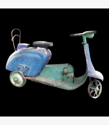 A weathered, vintage-style metal tricycle scooter sculpture featuring a distressed indigo and teal patina with authentic industrial detailing.