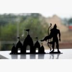 A sleek, matte black laser-cut metal silhouette of the Ram Mandir temple alongside Lord Rama holding a bow, perfect for spiritual home decor.