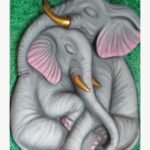 An original sculpted wall piece titled 'Tranquil Companions' featuring two grey elephants resting together on a textured green background.