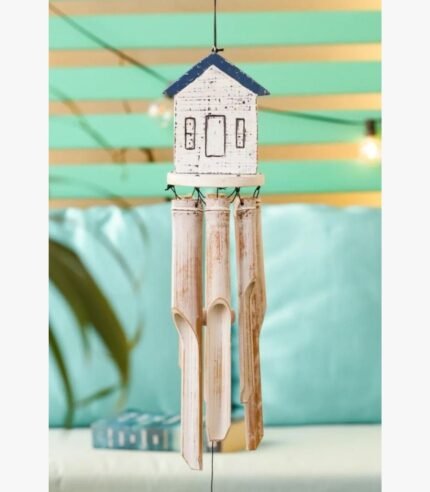 A handcrafted wind chime featuring a small white and blue wooden house top with dangling natural bamboo tubes, perfect for patio decor.