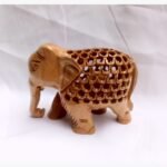 Three tall, elegant wooden cat sculptures in varying heights, adorned with intricate white dot-work and natural jute ribbon ties.