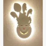 An original relief wall sculpture titled 'Divine Resonance' featuring a highly detailed deity figure with traditional ornamentation.
