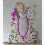 An original relief wall sculpture titled 'Eternal Presence' featuring an intricately detailed deity figure adorned with lotus flowers and traditional motifs.