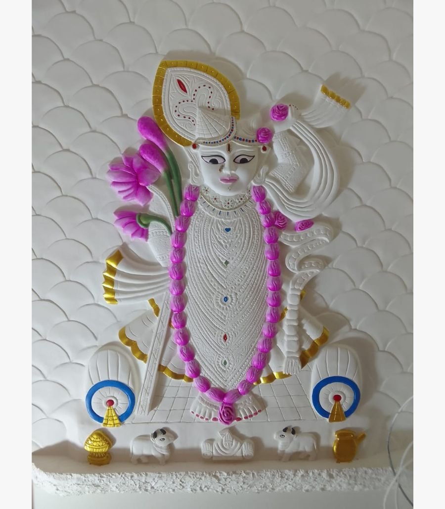 Eternal Presence An original relief wall sculpture titled 'Eternal Presence' featuring an intricately detailed deity figure adorned with lotus flowers and traditional motifs.