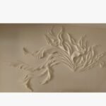 An original white relief wall sculpture titled 'Ethereal Flow' featuring a dynamic, abstract design of flowing curves and organic shapes.
