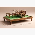 A grand 17-inch handcrafted wooden bullock cart and plough miniature on a turf-lined display pedestal with polished brass details.