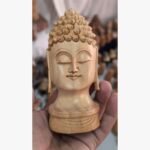 Experience serenity with this handcrafted wooden Buddha head. A timeless piece of mindful decor for your home. Order this unique sculpture today!