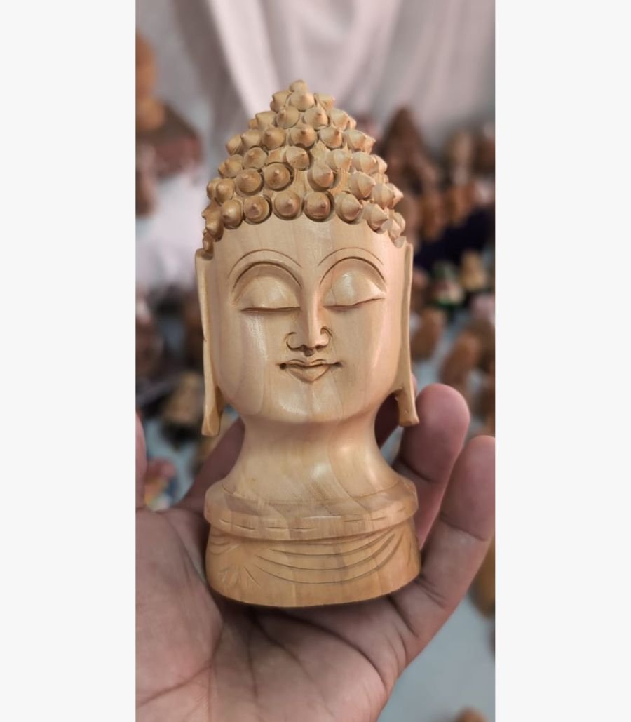 Hand-Carved Wooden Buddha Head Experience serenity with this handcrafted wooden Buddha head. A timeless piece of mindful decor for your home. Order this unique sculpture today!