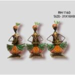 Handcrafted three-piece Rajasthani musicians iron sculpture set featuring hand-painted tribal folk figurines playing traditional instruments on individual square stands.