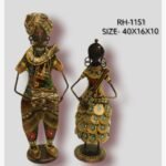 Handcrafted two-piece Rajasthani couple musicians iron statue set featuring a hand-painted traditional folk man playing a dholak and a woman with a stringed instrument on circular bases.