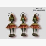 Handcrafted three-piece Rajasthani Ghoomar dancers iron sculpture set featuring hand-painted red flared skirts, green blouses, golden mesh belts, and traditional veils.