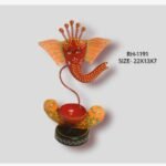 Handcrafted wrought iron traditional Indian Lord Ganesha diya holder titled Sacred Silhouette by Crafts Heritage featuring a vibrant red face, orange fan-shaped ears, a five-pronged crown, and a central candle cup on a circular base.