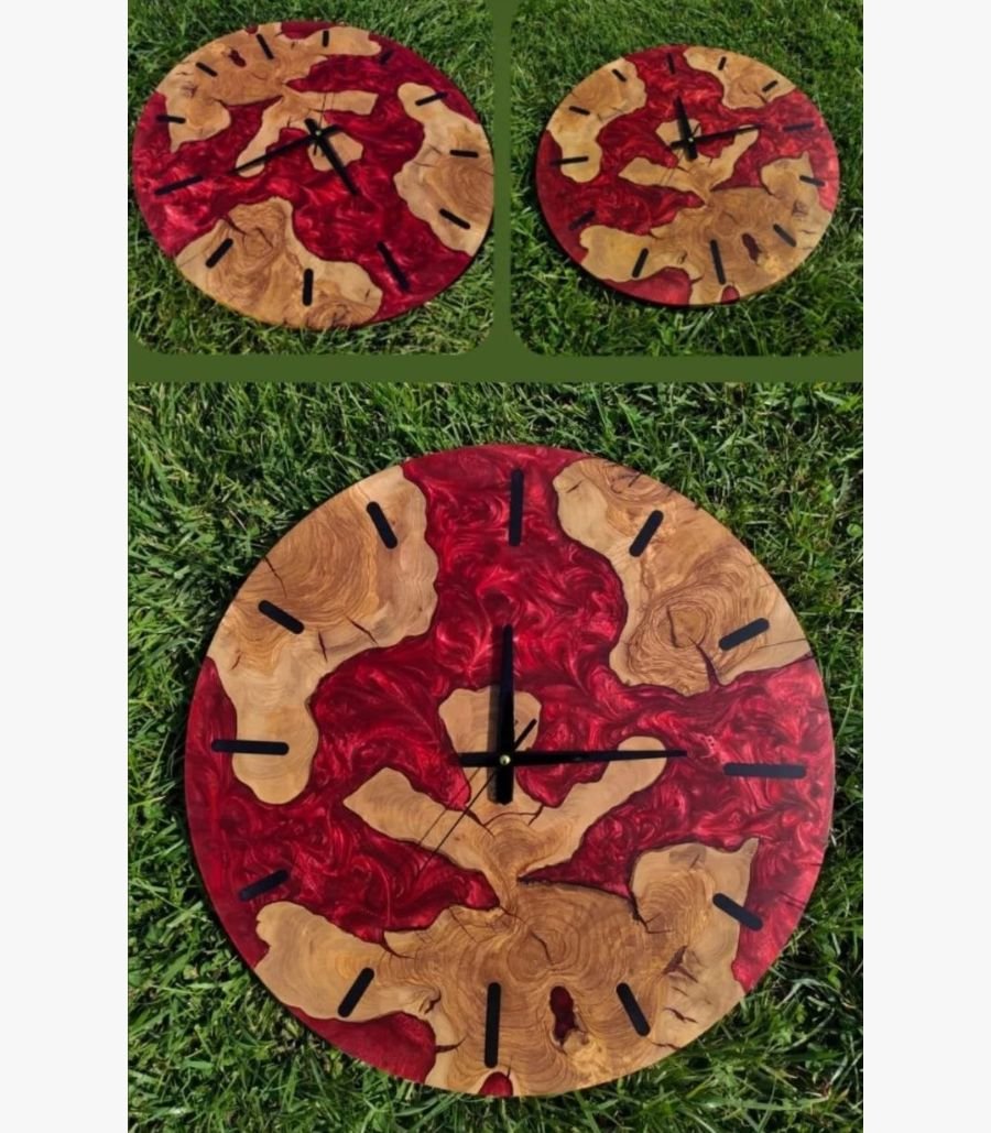 11 Handcrafted circular crimson red epoxy resin river wall clock titled Crimson Magma by Vina Bhavsar featuring raw live edge wood slabs embedded in metallic swirling red resin.