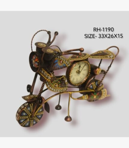 Handcrafted wrought iron vintage cruiser motorcycle sculpture desk clock titled Vintage Rider by Crafts Heritage featuring a textured bronze body adorned with vibrant traditional lacquer patterns and a built-in analog clock dial.