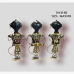 Handcrafted three-piece Rajasthani tribal women musicians iron sculpture set featuring hand-painted traditional female figures with looped wire legs on round base plinths.