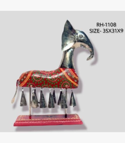 Handcrafted royal Rajasthani elephant metal sculpture table decor featuring a red painted body with green vine patterns and hanging metal bells on a stable pedestal base.