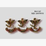 Handcrafted three-piece musical Ganesha sitting iron statue set featuring hand-painted traditional motifs and integrated wire instruments on semi-oval rocker bases.
