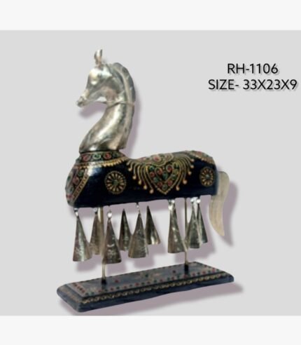 Handcrafted royal Rajasthani horse metal sculpture table decor featuring a dark black painted body with intricate gold patterns, studded gems, and hanging metal bells on a sturdy pedestal.
