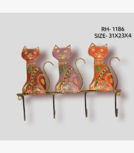 Handcrafted wrought iron decorative wall hanger with 4 hooks titled Feline Fable by Crafts Heritage featuring three vibrant red, purple, and orange hand-painted cats sitting in a row with curled wire tails.
