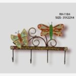 Handcrafted wrought iron decorative wall hanger with 4 hooks titled Fluttering Meadow by Crafts Heritage featuring a vibrant turquoise butterfly and a green dragonfly perched among elegant wire scrolls.