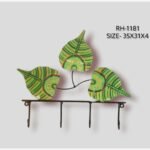 Handcrafted wrought iron decorative wall hanger with 4 hooks titled Verdant Trio by Crafts Heritage featuring three vibrant lime green hand-painted leaves accented with traditional folk lacquer patterns.