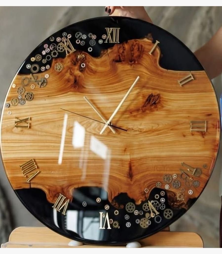 2 Handcrafted large circular wall clock titled Chronos by Vina Bhavsar combining live edge burl wood, black epoxy resin, gold Roman numerals, and metallic steampunk gears under a high-gloss finish.