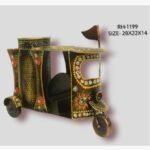 Handcrafted wrought iron traditional Indian auto rickshaw pen stand titled Nostalgic Ride by Crafts Heritage featuring a brown textured body with festive green, orange, and white hand-painted patterns and an integrated mesh utility cup.