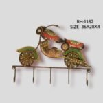 Handcrafted wrought iron decorative wall hanger with 5 hooks titled Vintage Cruiser by Crafts Heritage featuring a retro motorcycle design with hand-painted green, red, and gold folk art detailing.