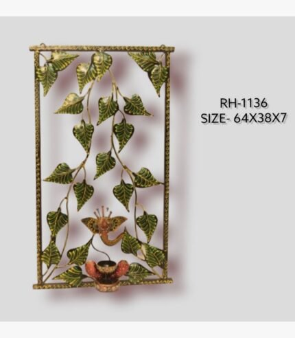 Handcrafted Ganesha Bodhi leaf metal wall art panel featuring cascading green peepal leaves and a central Lord Ganesha motif with an integrated diya holder inside a rectangular frame.