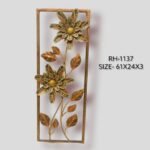 Handcrafted floral bloom vertical metal wall art panel featuring two large textured sunflowers with multi-tonal patterned petals and iron leaves inside a rectangular frame.