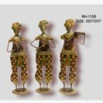 Handcrafted three-piece standing Rajasthani folk musicians iron statue set featuring hand-painted traditional attire and musical instruments on circular base plinths.