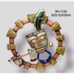 Handcrafted divine Shrinathji Krishna metal wall art sculpture featuring a textured white face, colorful crown, peacock feather, and flute inside a circular copper and gold frame.