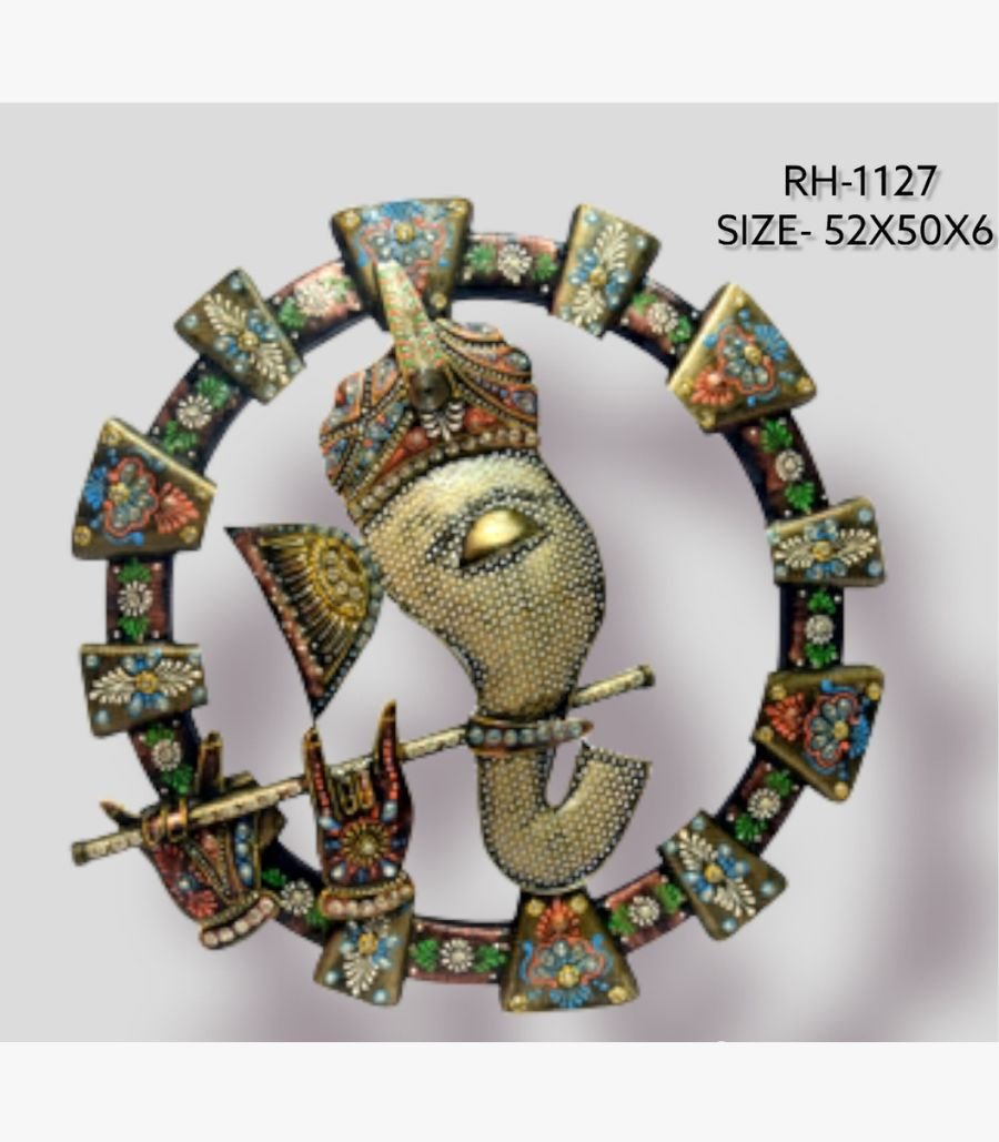 34 Handcrafted ornate Lord Ganesha metal wall art sculpture featuring a textured white metal face holding a flute inside an heavily painted circular floral ring frame.