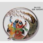 Handcrafted circular Radha Krishna on a swing metal wall art panel featuring a multi-color textured iron divine couple beneath a stylized overhanging tree.