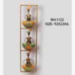 Handcrafted 3-tier vertical Rajasthani musicians metal wall art panel featuring three textured iron tribal folk players with traditional instruments in a stacked frame.