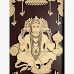 Handcrafted vertical 3D layered wooden wall panel titled Panchamukhi Hanuman featuring the five-faced deity with an ornate mace and hanging lamps against a deep chocolate brown background.