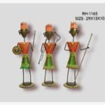 Handcrafted three-piece Rajasthani tribal warriors iron sculpture set featuring hand-painted traditional red and green attire holding a shield, bow, and spears on circular bases.