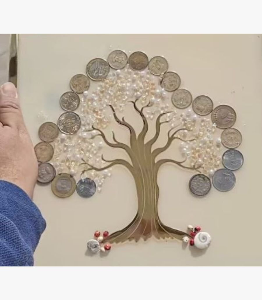 7 Handcrafted square multi-media wall art panel titled Golden Shrinidhi by Vina Bhavsar featuring a stylized gold tree silhouette adorned with genuine Indian coins, sparkling clear crystals, and delicate pearl beads under a protective gloss seal.