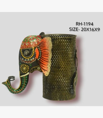Handcrafted wrought iron royal elephant pen stand titled Regal Elephant by Crafts Heritage featuring a black painted head with vibrant orange ears and festive green and red patterns alongside a metallic perforated storage cylinder.