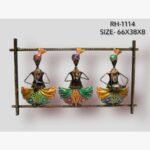 Handcrafted colorful Rajasthani folk musicians metal wall art panel featuring three standing figures with traditional turbans playing instruments inside a frame.