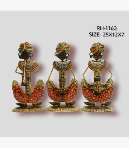 Handcrafted three-piece Rajasthani musicians iron sculpture set featuring hand-painted orange patterned dhotis, multi-colored turbans, and traditional folk instruments on flat oval bases.