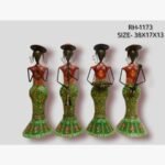 Handcrafted four-piece Rajasthani female musicians iron sculpture set featuring hand-painted green patterned skirts, orange bodices, and traditional folk instruments.