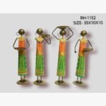 Handcrafted four-piece standing Rajasthani women tribal iron statue set featuring hand-painted traditional clothing and decorative ritual bowls on round base plinths.
