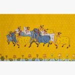 Traditional Rajasthani Pichwai painting titled Sacred Cows in Golden Meadow by artist Chanchal Soni, featuring beautifully adorned holy cows against a vibrant yellow star-lit background.