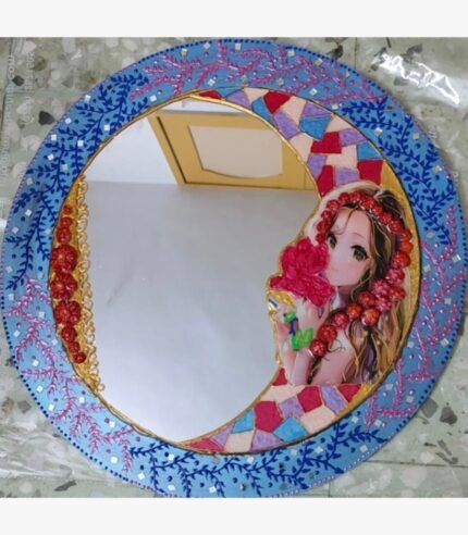 Handcrafted circular decorative mirror art titled Lunar Grace by Sabana Munshi featuring an anime-style maiden illustration within a colorful crescent moon and traditional blue Lippan clay work border.